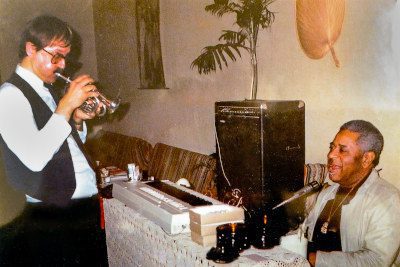 Ivan Nagy Serenading Dizzy Gillespie at Oops! the Wrong Door. Valentino's Restaurant, Vancouver, BC - late 1980s. Dizzy dropped by after his concert at the Vancouver Orpheum.